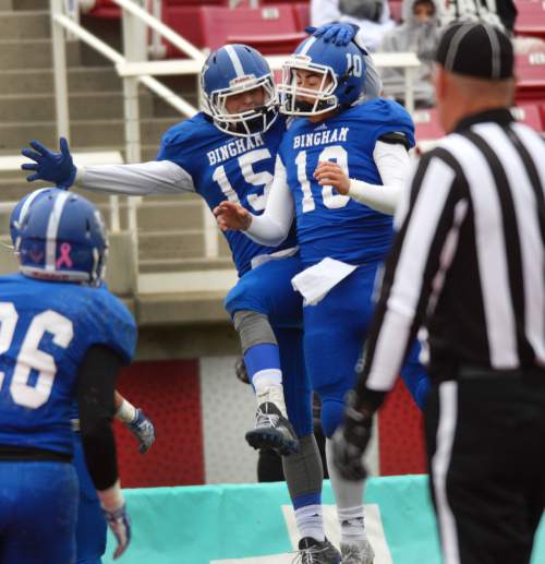 Steve Griffin  |  The Salt Lake Tribune

Bingham back-up quarterback Ben Boelter, right, leaps into the air and celebrates his touchdown pass to wide receiver Michael Green, left,  in the 5A semifinal football game between Bingham and Riverton at Rice-Eccles Stadium on the University of Utah campus in Salt Lake City, Utah Thursday, November 13, 2014.