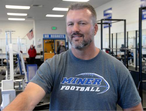 Al Hartmann  |  The Salt Lake Tribune
Dave Peck, Bingham football coach, works out in the high school's weight room.  He has been the state's top high school football coach the past few years.