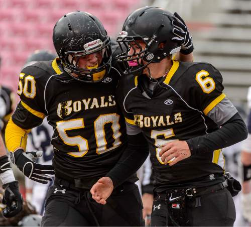 Trent Nelson  |  The Salt Lake Tribune
Roy's Bridger Gray (50) celebrates a touchdown by Roy's Tyler Skidmore (6) as Roy defeats Corner Canyon High School in a 4A state football semifinal game at Rice-Eccles Stadium in Salt Lake City, Friday November 14, 2014.