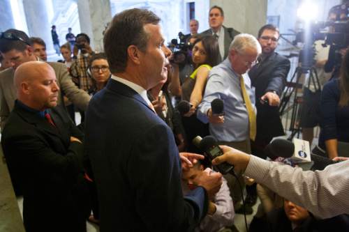 Chris Detrick  |  The Salt Lake Tribune

Attorney General John Swallow talks to members of the media outside of his office at the Utah State Capitol on June 19 after the House Republican Caucus voted to create a special committee to investigate allegations against him.