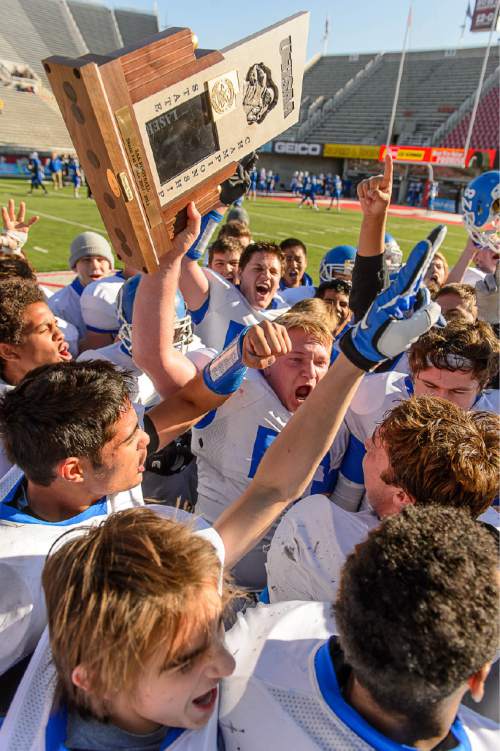 Trent Nelson  |  The Salt Lake Tribune
Dixie players celebrate their championship after defeating Hurricane High School in the 3AA state championship football game at Rice-Eccles Stadium in Salt Lake City Friday November 21, 2014.