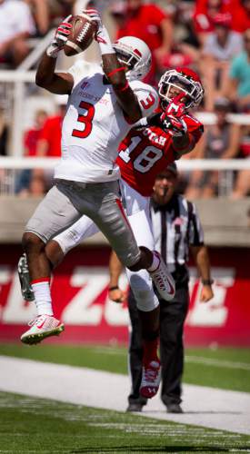Trent Nelson  |  The Salt Lake Tribune
Fresno State Bulldogs wide receiver Josh Harper (3) pulls in a pass in front of Utah Utes defensive back Eric Rowe (18) as Utah hosts Fresno State, college football at Rice-Eccles Stadium Saturday September 6, 2014.