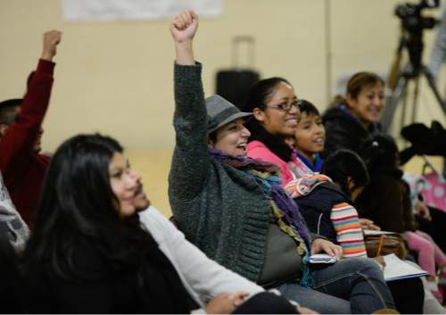 Francisco Kjolseth  |  The Salt Lake Tribune
Latinos gather at Centro Civico Mexicano to watch the live events from the White House during the historic announcement by  President Barack Obama to transform immigration policy and spare 5 million from deportation.