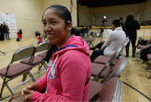 Francisco Kjolseth  |  The Salt Lake Tribune
Elida Astuhuaman, who has lived in the U.S. for 14-years, and a single mother of two who were born in the U.S. expresses her excitement but apprehension with the latest immigration news. Latinos gathered at Centro Civico Mexicano to watch the live events from the White House during the historic announcement by President Barack Obama to transform immigration policy and spare 5 million from deportation.