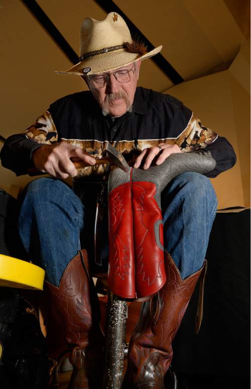 Scott Sommerdorf  |  The Salt Lake Tribune
Sanpete County boot maker Don Walker works on a pair of boots at the University of Utah Museum of Natural History as part of "The Horse" exhibit, Saturday, Nov. 22, 2014.