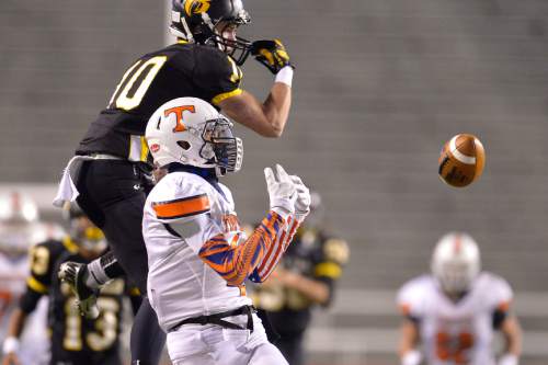 Chris Detrick  |  The Salt Lake Tribune
Roy's Jaden Brown (10) breaks up a pass intended for Timpview's Samson Nacua (4) during the 4A state championship game at Rice-Eccles Stadium Friday November 21, 2014.