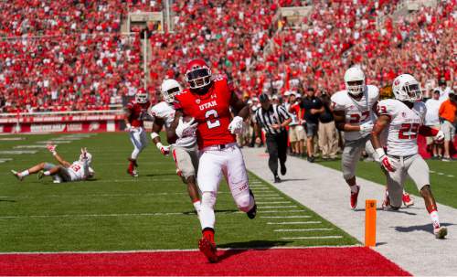 Trent Nelson  |  The Salt Lake Tribune
Utah Utes wide receiver Kenneth Scott (2) scores a touchdown as Utah hosts Fresno State, college football at Rice-Eccles Stadium Saturday September 6, 2014.