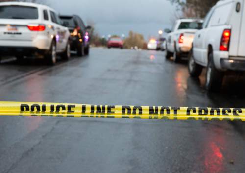 Rick Egan  |  The Salt Lake Tribune

Investigators on the scene of a shooting in South Jordan on Brook North Lance Lane, Saturday, November 22, 2014