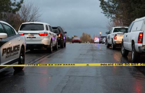 Rick Egan  |  The Salt Lake Tribune

Investigators on the scene of a shooting in South Jordan on Brook North Lance Lane, Saturday, November 22, 2014