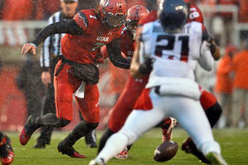 Chris Detrick  |  The Salt Lake Tribune
Utah Utes quarterback Travis Wilson (7) fumbles the ball during the game at Rice-Eccles Stadium Saturday November 22, 2014. Arizona Wildcats defeated Utah Utes 42-10.