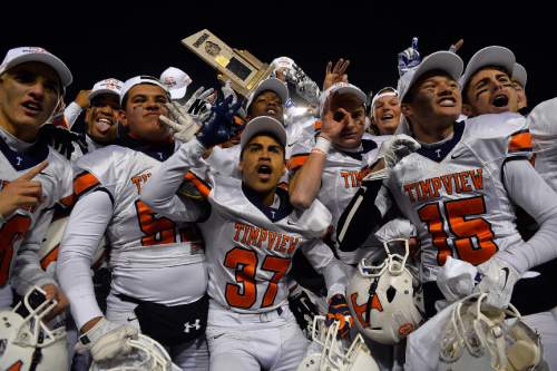 Chris Detrick  |  The Salt Lake Tribune
Members of the Timpview football team celebrate after winning the 4A state championship game at Rice-Eccles Stadium Friday November 21, 2014.