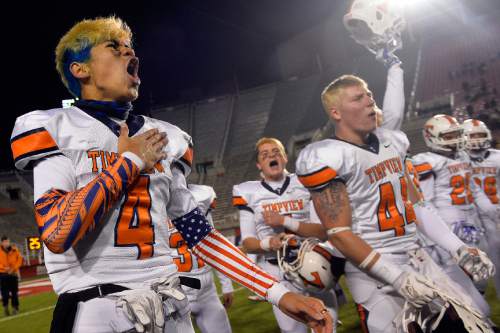 Chris Detrick  |  The Salt Lake Tribune
Timpview's Samson Nacua (4) and his teammates celebrate after winning the 4A state championship game at Rice-Eccles Stadium Friday November 21, 2014.