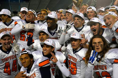 Chris Detrick  |  The Salt Lake Tribune
Members of the Timpview football team celebrate after winning the 4A state championship game at Rice-Eccles Stadium Friday November 21, 2014.
