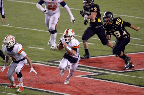 Chris Detrick  |  The Salt Lake Tribune
Timpview's Britain Covey (2) runs the ball past Roy defense during the 4A state championship game at Rice-Eccles Stadium Friday November 21, 2014.