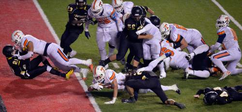 Chris Detrick  |  The Salt Lake Tribune
Timpview's Tristan Bradley (6) scores a touchdown past Roy's Tyler Eteuati (24) during the 4A state championship game at Rice-Eccles Stadium Friday November 21, 2014.