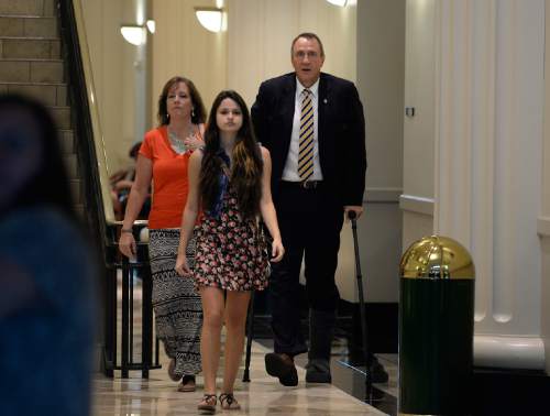 Scott Sommerdorf   |  The Salt Lake Tribune
Former Utah attorney general Mark Shurtleff, arrives with his wife M'Liss and his daughter Danielle to make his initial court appearances on charges of receiving or soliciting bribes, accepting gifts, tampering with evidence, obstructing justice and participating in a pattern of unlawful conduct, Wednesday, July 30, 2014.