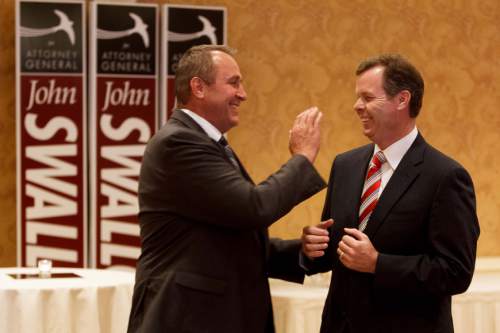 Trent Nelson  |  Tribune file photo

Utah Attorney General Mark Shurtleff, left, and Utah Attorney General candidate John Swallow share a laugh on the night Swallow secured the Republican nomination to run for the attorney general's office.