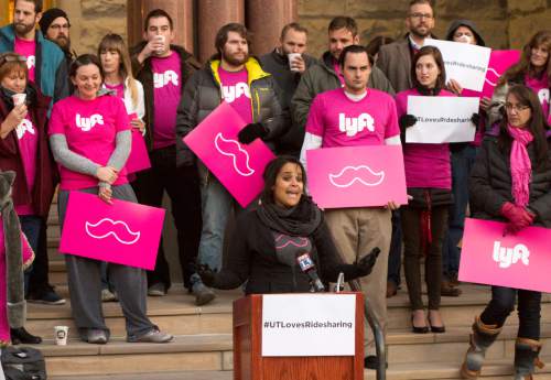 Rick Egan  |  The Salt Lake Tribune

Lyft driver, Angie Palmer, speaks at a rally Monday afternoon. Tomorrow the Salt Lake City Council will vote on whether they will require the rideshare companies to submit to driver background checks, vehicle inspection, and liability insurance. Monday, November 24, 2014.