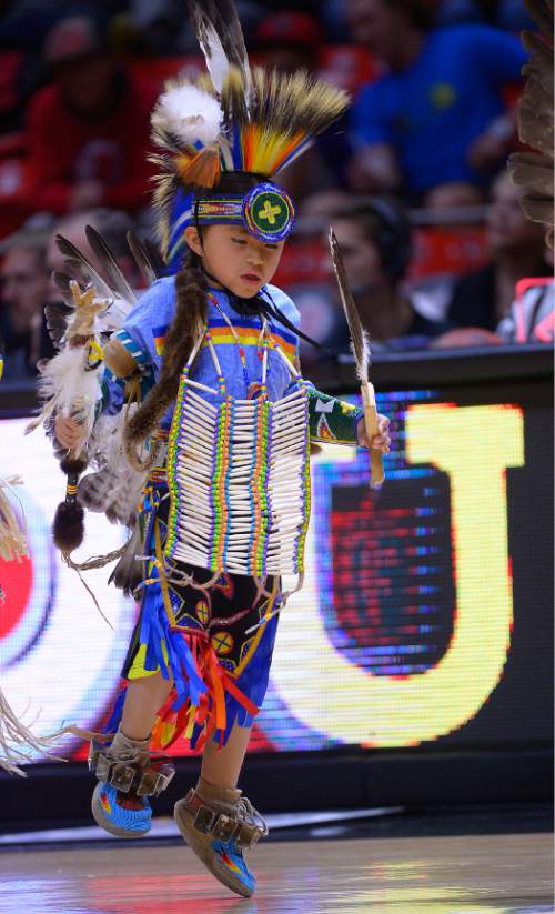 Leah Hogsten  |  The Salt Lake Tribune
To celebrate the Ute Proud campaign, a partnership between the Ute tribe and the University of Utah, and Native American Heritage Month, members of the Ute tribe filled the basketball court in dance during halftime of   the University of Utah and UC Riverside game, November 21, 2014, at the Jon M. Huntsman Center.