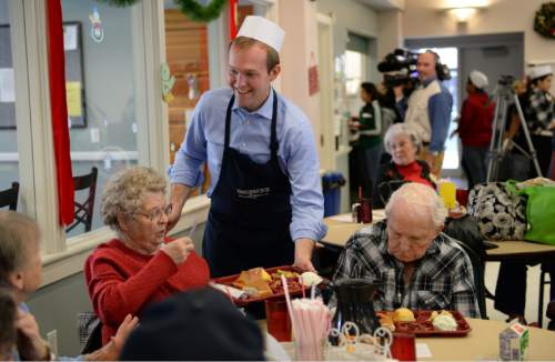 Francisco Kjolseth  |  The Salt Lake Tribune
Salt Lake County Mayor Ben McAdams dons an apron to serve meals to seniors at the Salt Lake County senior center in Kearns on Tuesday, Dec. 17, 2013. The event is part of a Salt Lake County division of Aging Services holiday tradition to give back to our seniors who have helped build our communities and remain active members today.