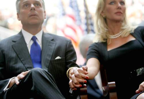 (Tribune file photo)  Jon Huntsman holds the hand of his wife Mary Kaye during Gary Herbert's inauguration as Utah's new governor Aug. 11, 2009,  at the Utah State Capitol in Salt Lake City.  (Keith Johnson, POOL)