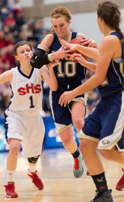 Trent Nelson  |  The Salt Lake Tribune
Skyline's Mia Mortensen heads to the basket with Springville's Lydia Austin defending as Springville faces Skyline High School in the 4A girls high school basketball tournament state championship game in Taylorsville, Saturday, March 1, 2014.