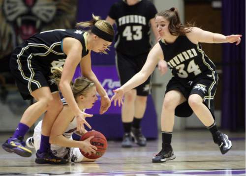 Kim Raff  |  The Salt Lake Tribune
Morgan player (middle) Allison Tonks tries to hang onto the ball as Desert Hills players (left) Blair Bliss and Alyssa Tomlinson try and steal the ball during the 3A girls' state quarterfinal game at Weber State University in Ogden on February 21, 2013.