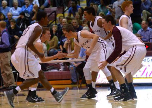 Leah Hogsten  |  The Salt Lake Tribune
Lone Peak players react to the win. Lone Peak High School defeated Layton High School 73-70, Tuesday, November 25, 2014 in Highland.