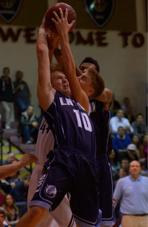 Leah Hogsten  |  The Salt Lake Tribune
Lone Peak's Nick Curtis and Layton's Matt Cragun fight for a rebound. Lone Peak High School defeated Layton High School 73-70, Tuesday, November 25, 2014 in Highland.