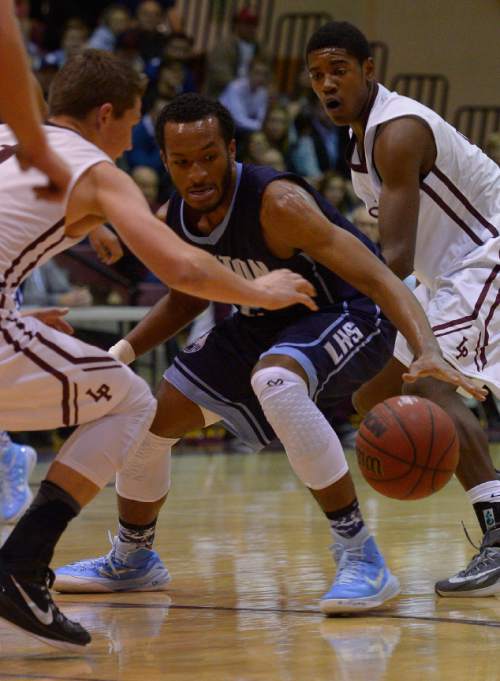 Leah Hogsten  |  The Salt Lake Tribune
Lone Peak's Tyson Doman pressures Layton's Jarriesse Blackmon for the ball. Lone Peak High School defeated Layton High School 73-70, Tuesday, November 25, 2014 in Highland.