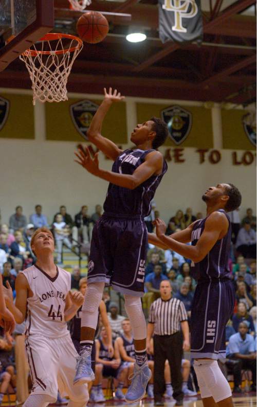 Leah Hogsten  |  The Salt Lake Tribune
Layton's Julian Blackmon hits the net. Lone Peak High School defeated Layton High School 73-70, Tuesday, November 25, 2014 in Highland.