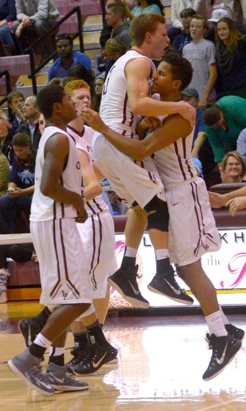 Leah Hogsten  |  The Salt Lake Tribune
Lone Peak players react to the win. Lone Peak High School defeated Layton High School 73-70, Tuesday, November 25, 2014 in Highland.