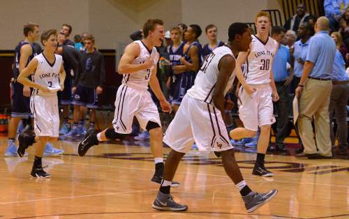 Leah Hogsten  |  The Salt Lake Tribune
Lone Peak players react to the win. Lone Peak High School defeated Layton High School 73-70, Tuesday, November 25, 2014 in Highland.