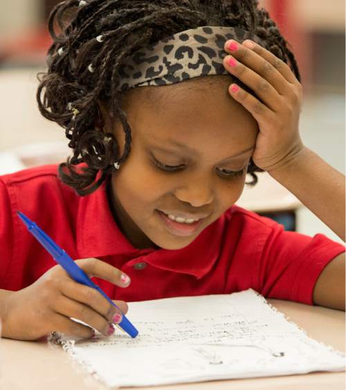 Rick Egan  |  The Salt Lake Tribune

Eight-year-old Alia Bugingo works on an assignment in her second grade class at North Star Elementary on Nov. 19, 2014.