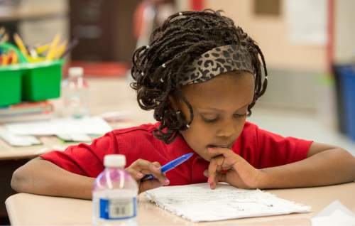Rick Egan  |  The Salt Lake Tribune

Eight-year-old Alia Bugingo works on an assignment in her second grade class at North Star Elementary Nov. 19, 2014.