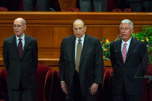 Chris Detrick  |  The Salt Lake Tribune
Elder Henry B. Eyring, LDS President Thomas S. Monson and President Dieter F. Uchtdorf sing during the morning session of the 184th Semiannual General Conference of The Church of Jesus Christ of Latter-day Saints at the Conference Center in Salt Lake City Saturday October 4, 2014.
