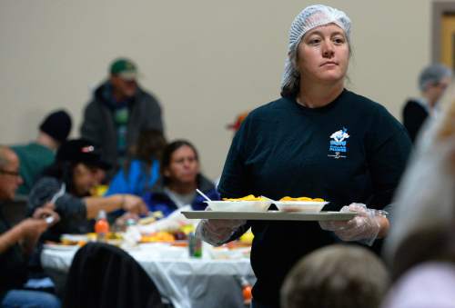 Leah Hogsten  |  The Salt Lake Tribune
"It's a little emotional, but it's good," said Susan Schaefer of her first year volunteering to serve Thanksgiving meals to the low-income and homeless. The Salt Lake City Mission provided Thanksgiving meals at the Christian Life Center, Thursday, November 27, 2014 in Salt Lake City.