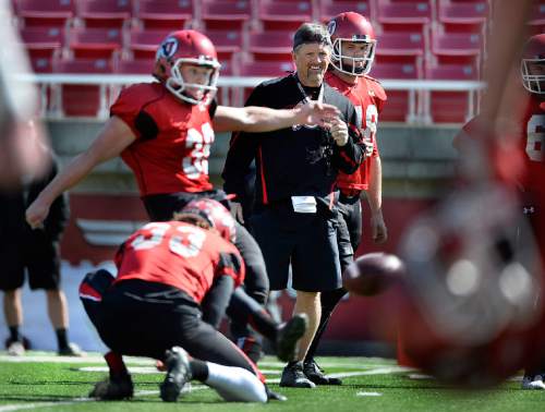 Scott Sommerdorf   |  The Salt Lake Tribune
Utah head coach Kyle Whittingham watches as K Andy Phillips practices field goal kicking during Utah football practice at Rice Eccles Stadium, Saturday, March 22, 2014.