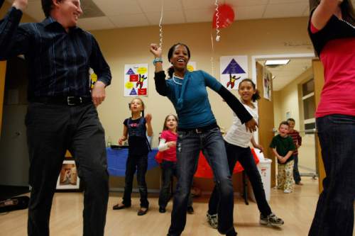 From left, Michael McOmber, Abi Love, Kennedy McOmber, Mia Love, Alessa Love and Breanna McOmber dance the 'Hoedown Throwdown' at the Avondale Academy on Tuesday, Nov. 3, 2009. Mia Love won her race for Saratoga Springs mayor. In the background watching is Jimmy Miller and Levi Parry. 
Photo by Chris Detrick  /  The Salt Lake Tribune