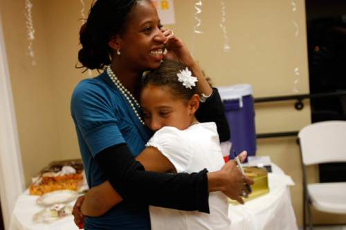 Photo by Chris Detrick  |  The Salt Lake Tribune 
Mia Love hugs her daughter Alessa after learning that she was elected mayor of Saratoga Springs at the Avondale Academy.  "I am incredibly honored and humbled that the people of Saratoga Springs voted me in as mayor," said Love.