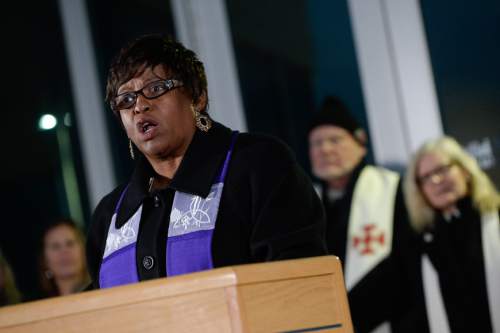 Francisco Kjolseth  |  The Salt Lake Tribune
Pastor Vinnetta Golphin-Wilkerson joins other community religious leaders along with Salt Lake County Sheriff Jim Winder and Unified Police Department officials in a call for civility and unity after the unrest in Ferguson, Mo. The event was held at the Salt Lake County Sheriff's Office along with a few members of the community on Sunday, Nov. 30, 2014.
