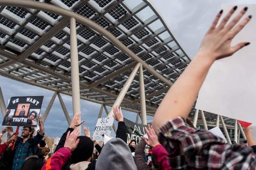 Trent Nelson  |  The Salt Lake Tribune
Protesters hold their hands over their heads in front of the Salt Lake City public safety building as more than 200 people turned out for a rally to protest police brutality in Salt Lake City, Saturday November 29, 2014.
