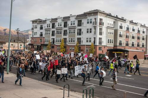 Trent Nelson  |  The Salt Lake Tribune
Protesters march, blocking traffic as more than 200 people turned out for a rally to protest police brutality in Salt Lake City, Saturday November 29, 2014.