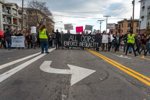Trent Nelson  |  The Salt Lake Tribune
Protesters march, blocking traffic as more than 200 people turned out for a rally to protest police brutality in Salt Lake City, Saturday November 29, 2014.