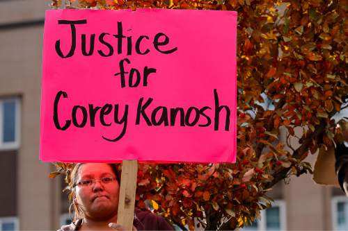 Trent Nelson  |  The Salt Lake Tribune
Ernestine Kanosh holds a sign calling for justice in the Corey Kanosh case, as more than 200 people turned out for a rally to protest police brutality in Salt Lake City, Saturday November 29, 2014.