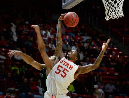 Utah guard Delon Wright (55) grabs a rebound during the second half on an NCAA college basketball game, Friday, Nov. 28, 2014 in Salt Lake City. (AP Photo/The Salt Lake Tribune, Scott Sommerdorf)  DESERET NEWS OUT; LOCAL TELEVISION OUT; MAGS OUT