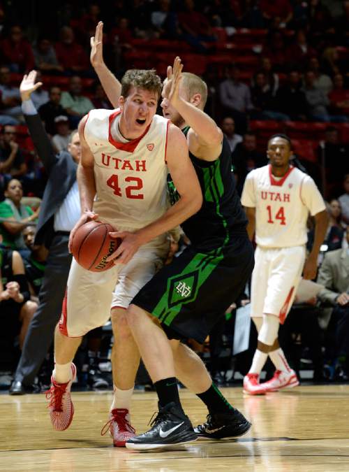 Utah forward Jakob Poeltl (42) fights to the basket against North Dakota  forward/center Ryan Salmonson (41) during the first half on an NCAA college basketball game, Friday, Nov. 28, 2014 in Salt Lake City. (AP Photo/The Salt Lake Tribune, Scott Sommerdorf)  DESERET NEWS OUT; LOCAL TELEVISION OUT; MAGS OUT