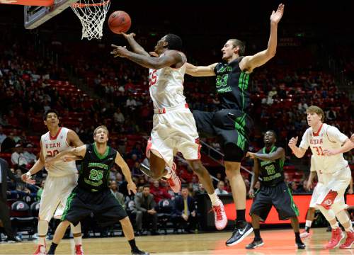 Utah guard Delon Wright (55) drives to score against North Dakota forward Chad Calcaterra (33) during the first half on an NCAA college basketball game, Friday, Nov. 28, 2014 in Salt Lake City. (AP Photo/The Salt Lake Tribune, Scott Sommerdorf)  DESERET NEWS OUT; LOCAL TELEVISION OUT; MAGS OUT