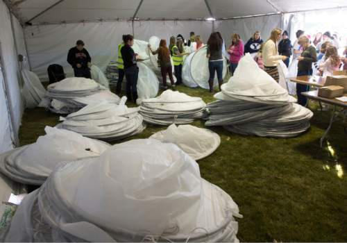 Steve Griffin  |  The Salt Lake Tribune

People are fitted in their costumes at Rock Canyon Park as they joined 1039 participants in an attempt to break a world record for a living nativity in Provo, Monday, December 1, 2014.