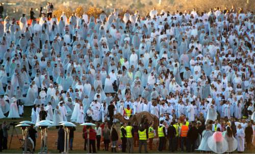 Steve Griffin  |  The Salt Lake Tribune

People dressed all in white and wearing their costumes are joined by a camel and other barnyard animals at Rock Canyon Park as they are counted during an attempt to break a world record for a living nativity in Provo, Monday, December 1, 2014.